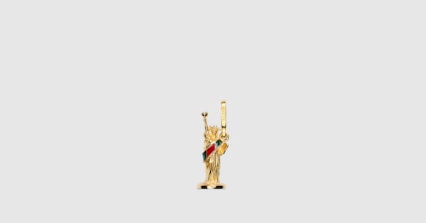 Statue of Liberty motif charm in gold-toned brass | GUCCI® US