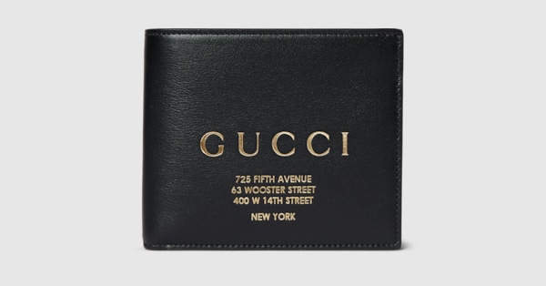 Bi-fold wallet with gold-foiled logo in black leather | GUCCI® CA