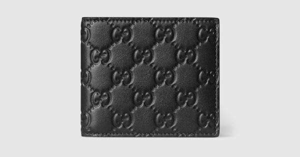 GG Emblem bi-fold wallet in black GG leather | GUCCI® US