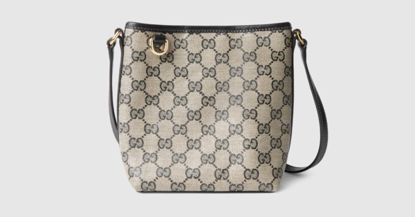 GG Emblem nano bucket bag in beige and black GG canvas | GUCCI® US
