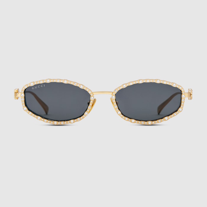 Oval frame sunglasses in yellow gold-toned | GUCCI® US display picture 1