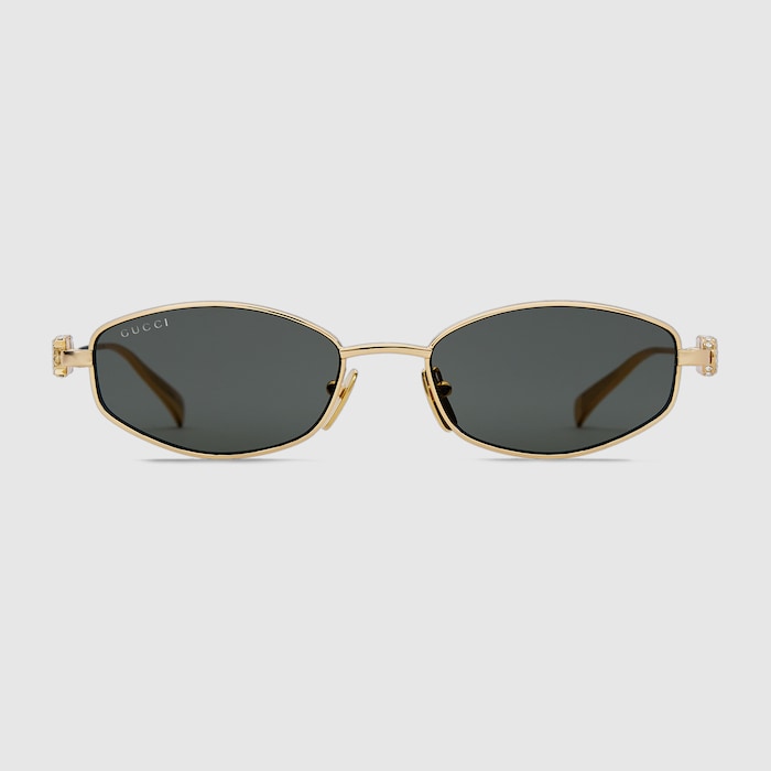 Oval frame sunglasses in yellow gold-toned | GUCCI® GR