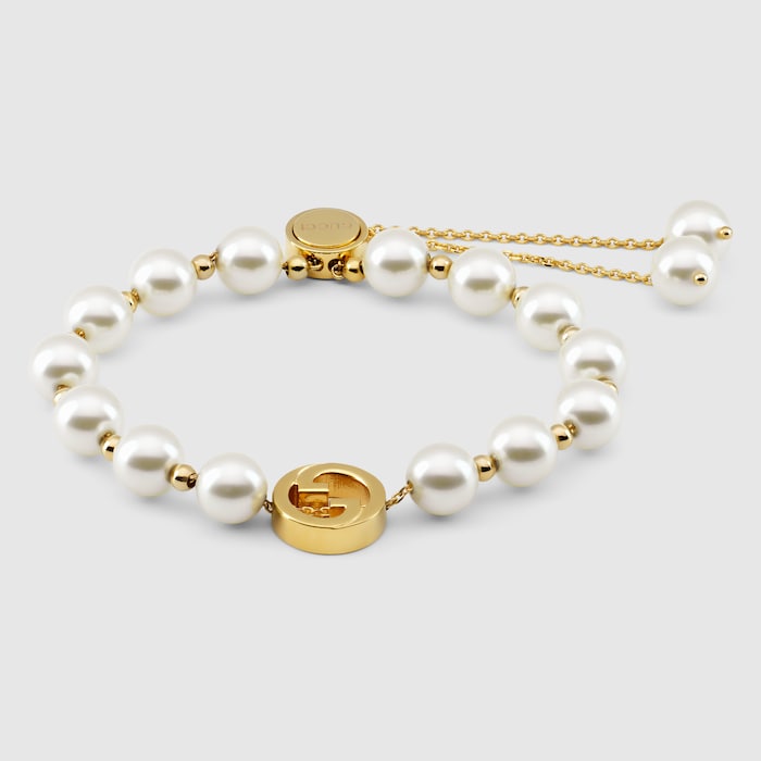 Gucci Interlocking pearl bracelet in light gold-toned brass