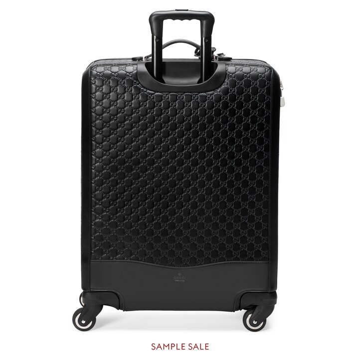 black gucci suitcase