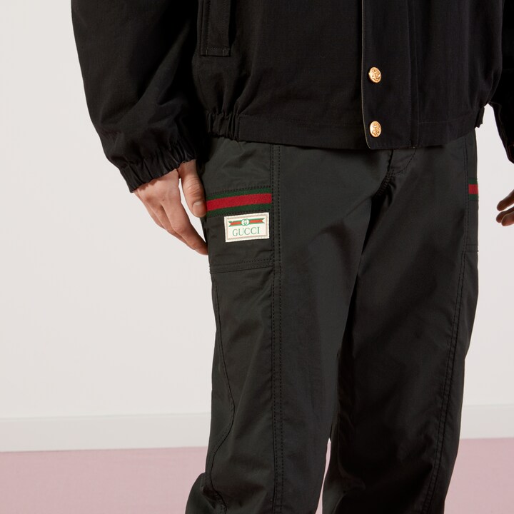 Coated cotton pant with Gucci label in black GUCCI® US