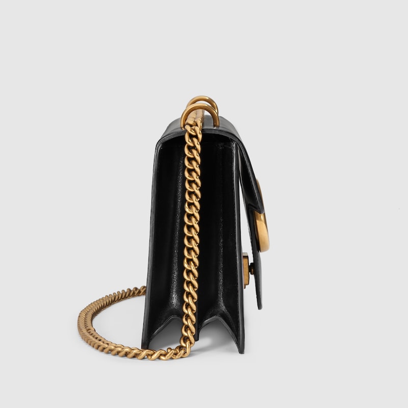 black gucci bag with heart on back