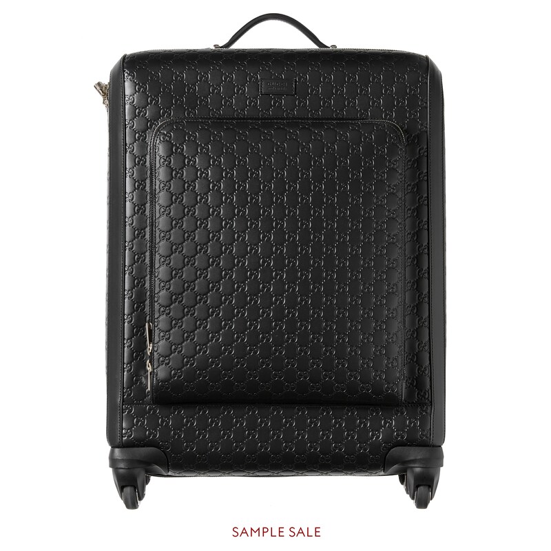 black gucci luggage set