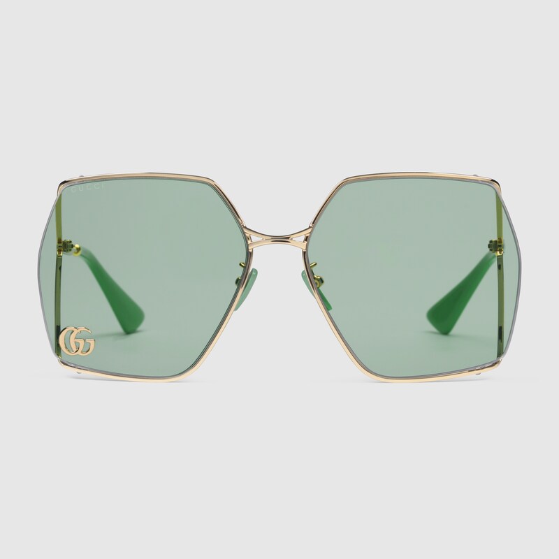 Occhiali da sole ovali in metallo color oro e celeste | GUCCI® Italia