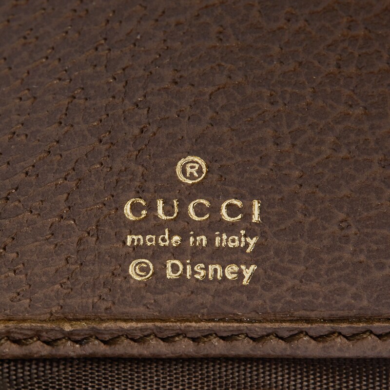 Disney X Gucci唐老鸭印花全拉链式钱包in米色和乌木色gg Supreme帆布 Gucci De Disney X Gucci唐老鸭印花全拉链式钱包in米色和乌木色gg Supreme帆布 Gucci De