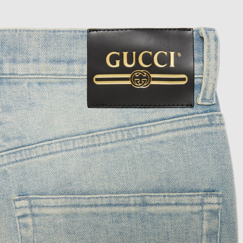 Blue Washed denim flare pant with Gucci label GUCCI® US
