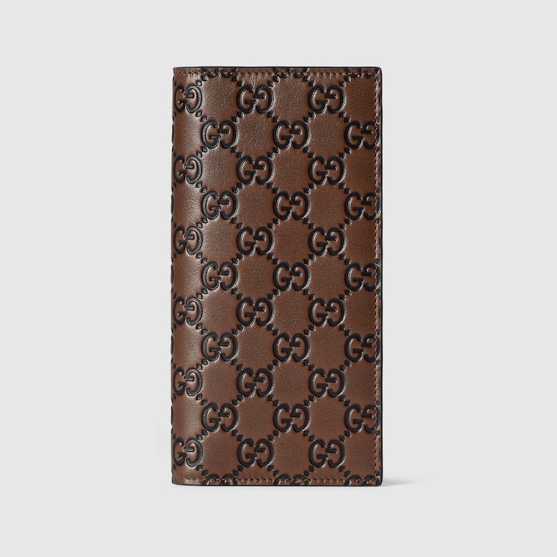 Gucci Men Gg Emblem Leather Wallet With Embossed Gg Motif In Brown