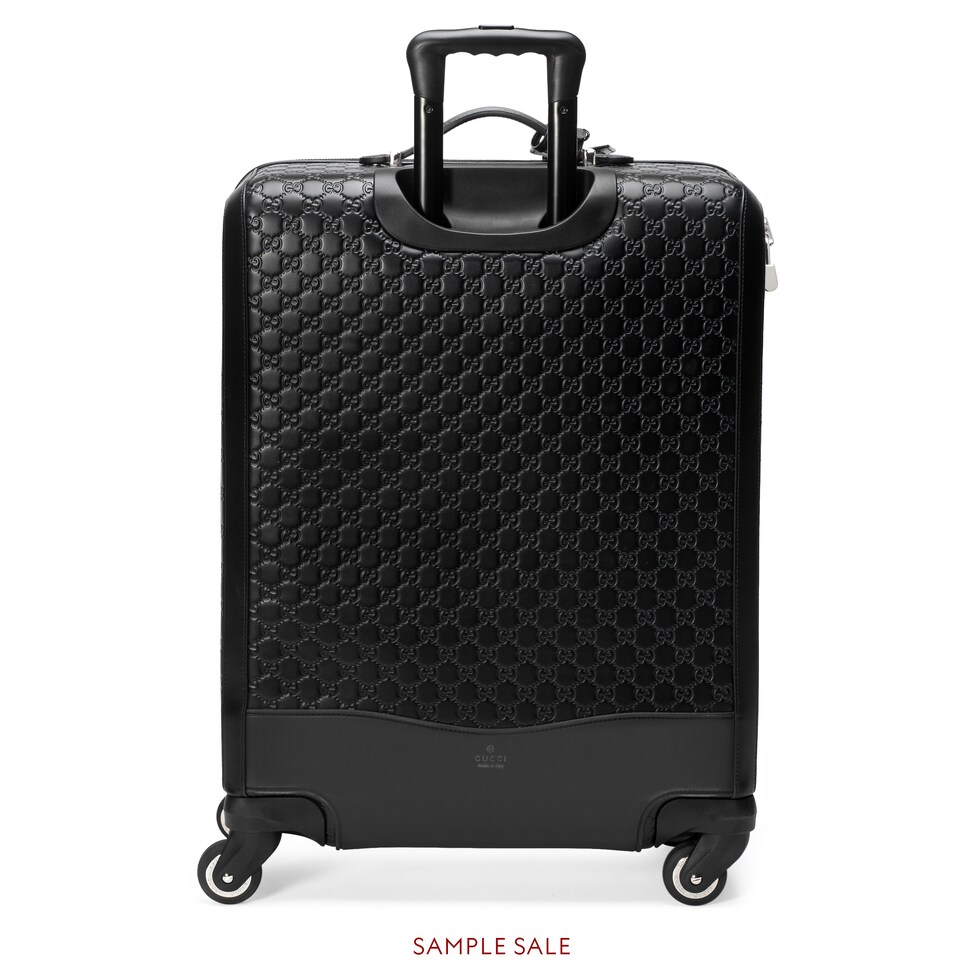 black gucci luggage