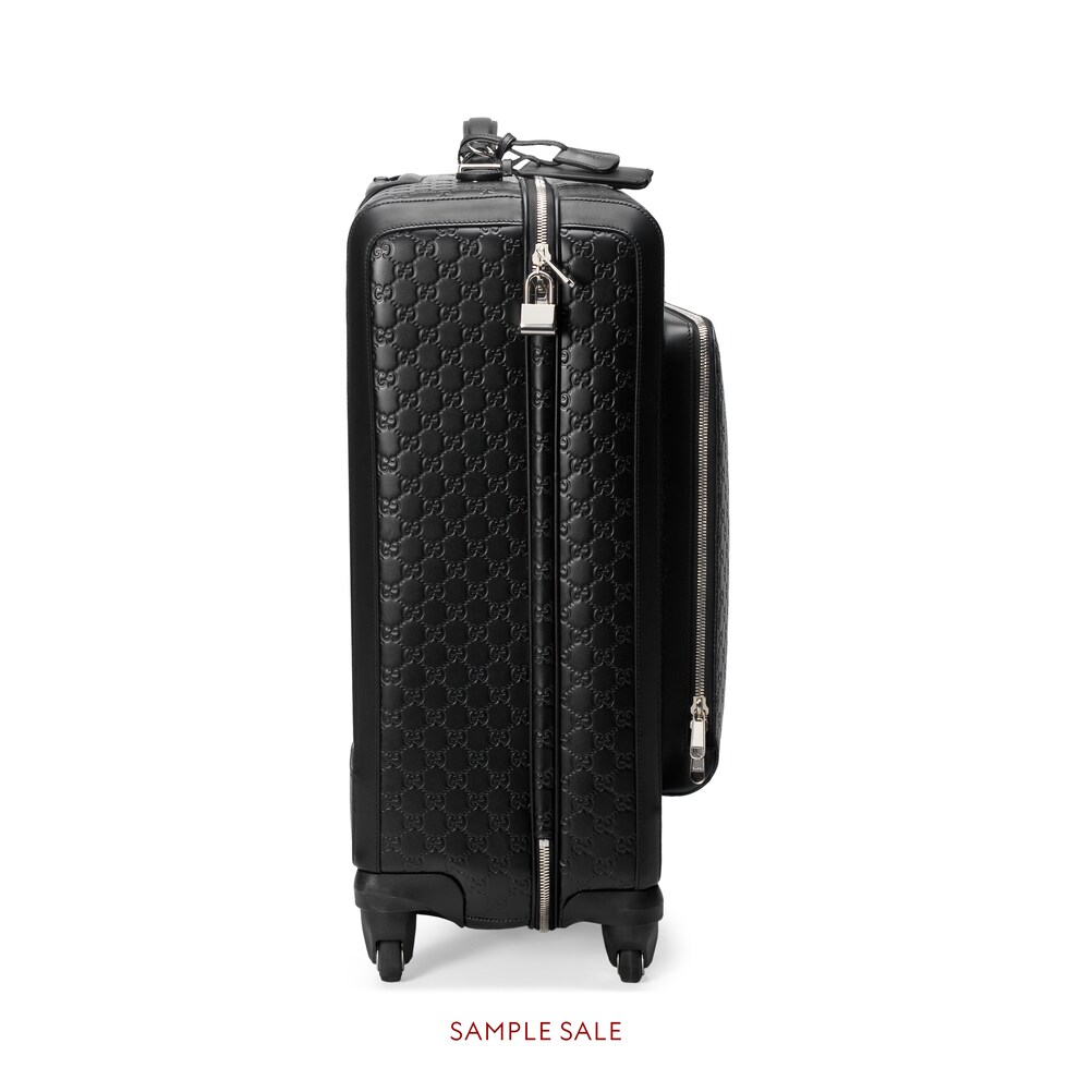 black gucci luggage set