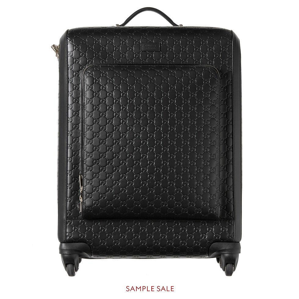 black gucci luggage