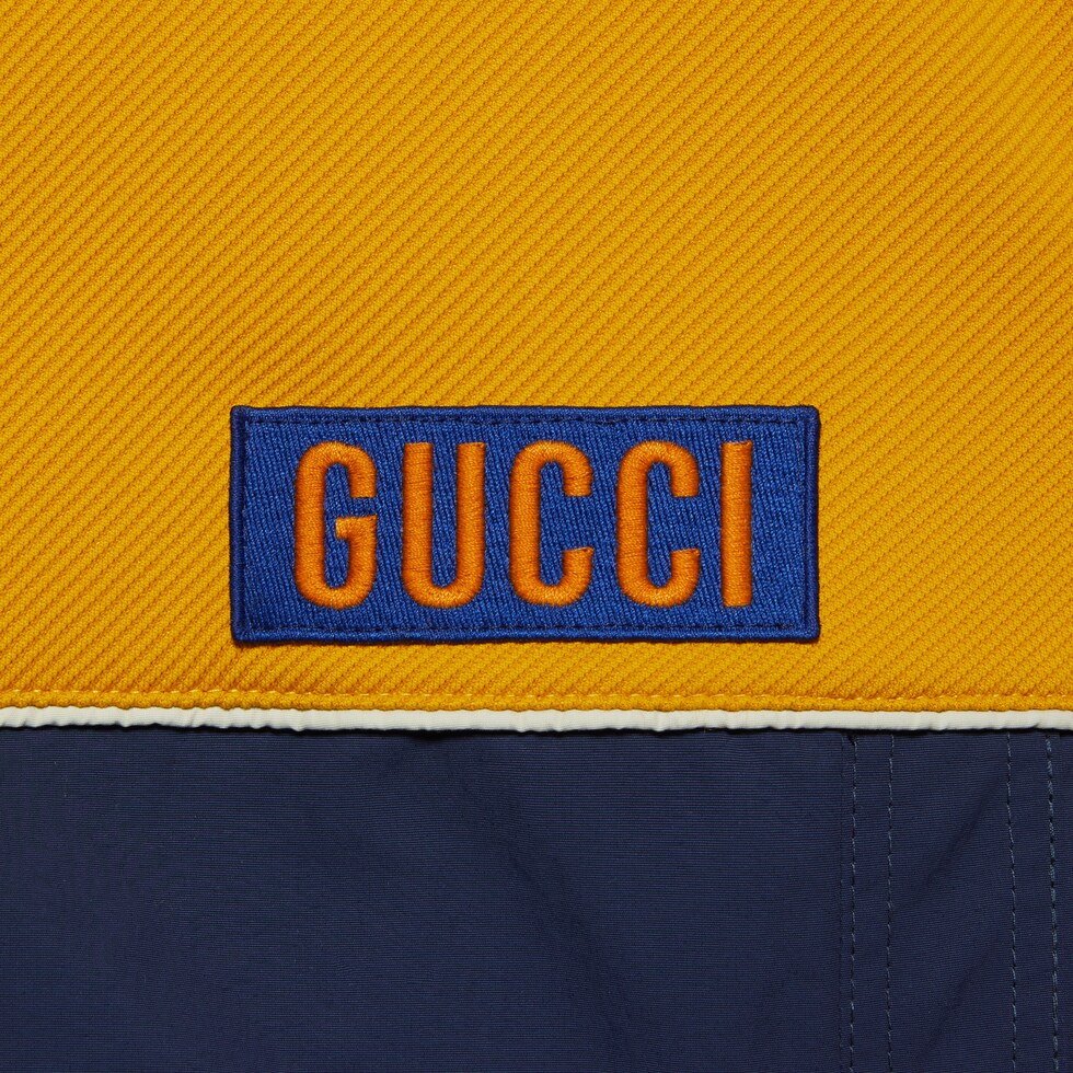 Technical jersey jacket with detachable sleeves in yellow and blue GUCCI AE