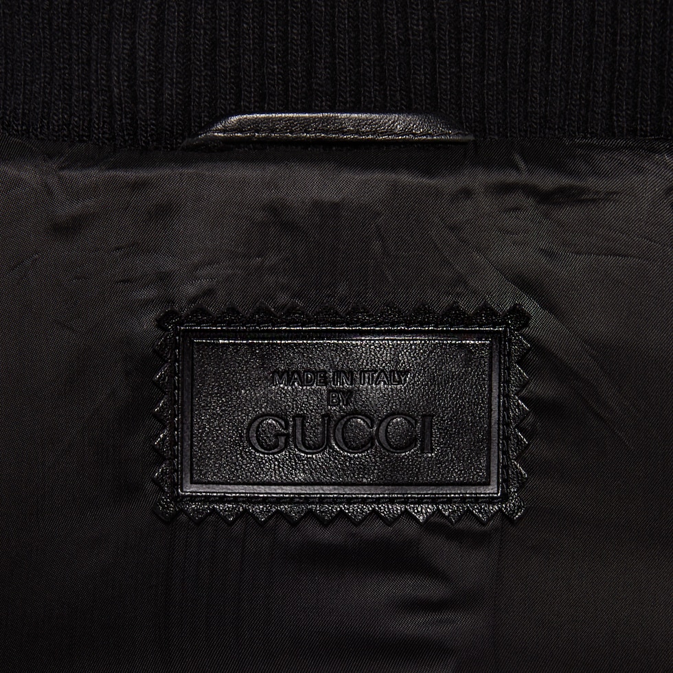 GG-embossed leather bomber jacket | Gucci