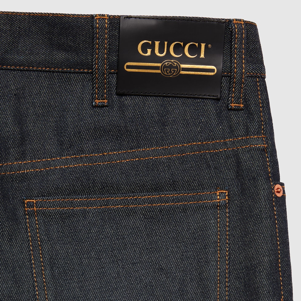 Denim trousers with cuffs in dark blue | GUCCI® ZA