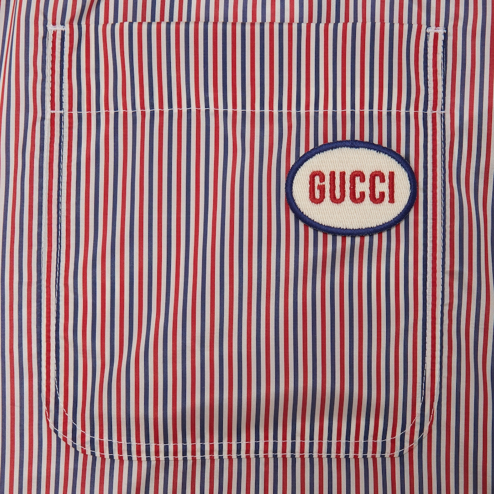 Striped fabric swim shorts with patch in ivory and red GUCCI SG