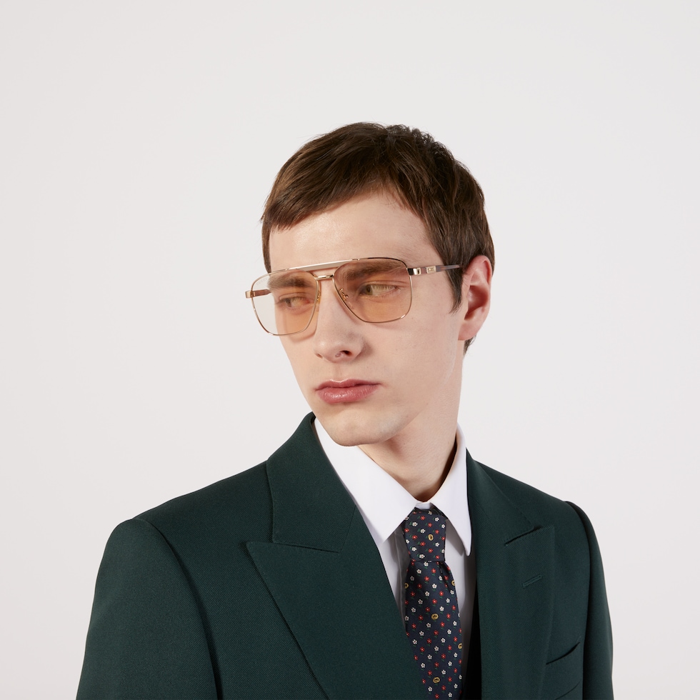 Navigator frame sunglasses in gold toned metal GUCCI SE