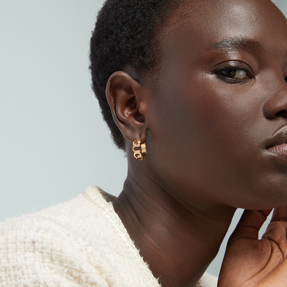 GUCCI' letter hoop earrings in yellow gold-toned | GUCCI® US
