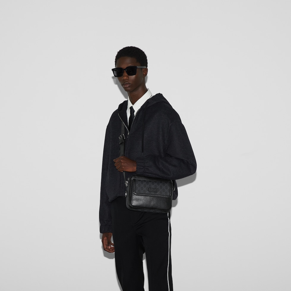 Small GG crossbody bag with tag in black leather | GUCCI® US