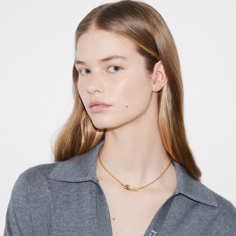Chain necklace with Gucci script in yellow gold-toned metal