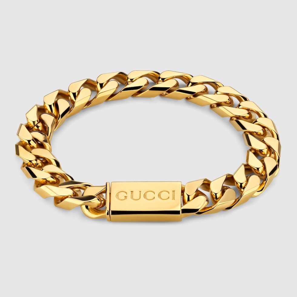 Chain bracelet with Gucci script tag in yellow gold toned metal GUCCI US