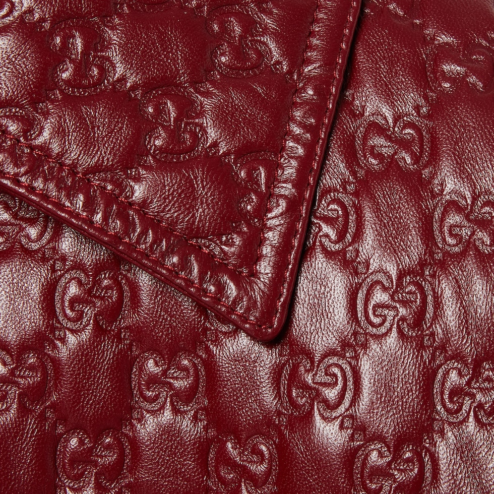 GG embossed leather jacket in Gucci Rosso Ancora red | GUCCI® US