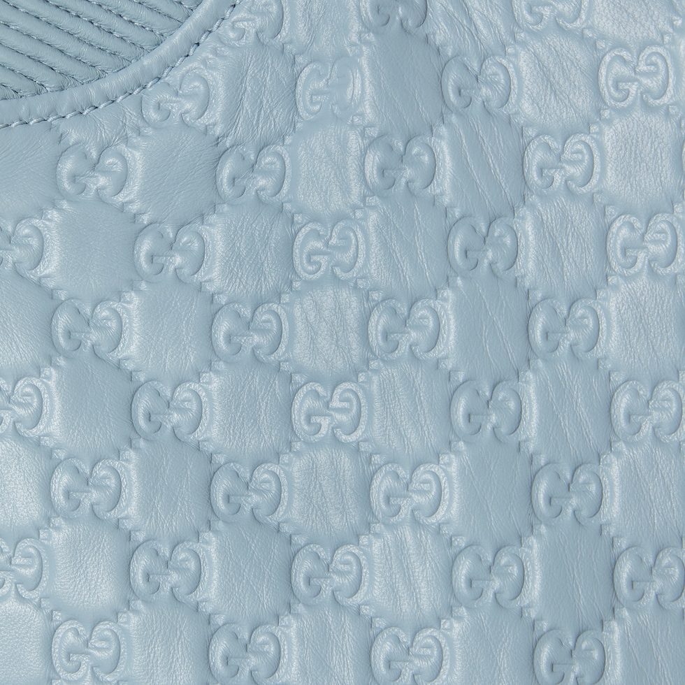 Embossed GG leather bomber jacket in light blue | GUCCI® US