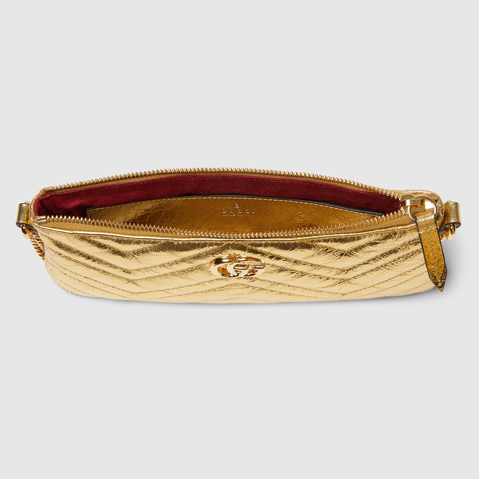 GG Marmont pochette with chain in gold leather | GUCCI® US
