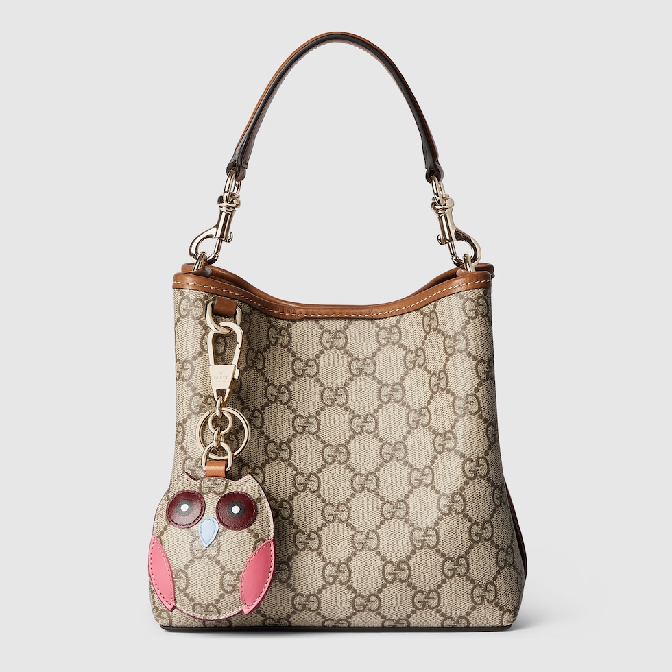 GG Emblem small bucket bag in beige and dark brown fabric