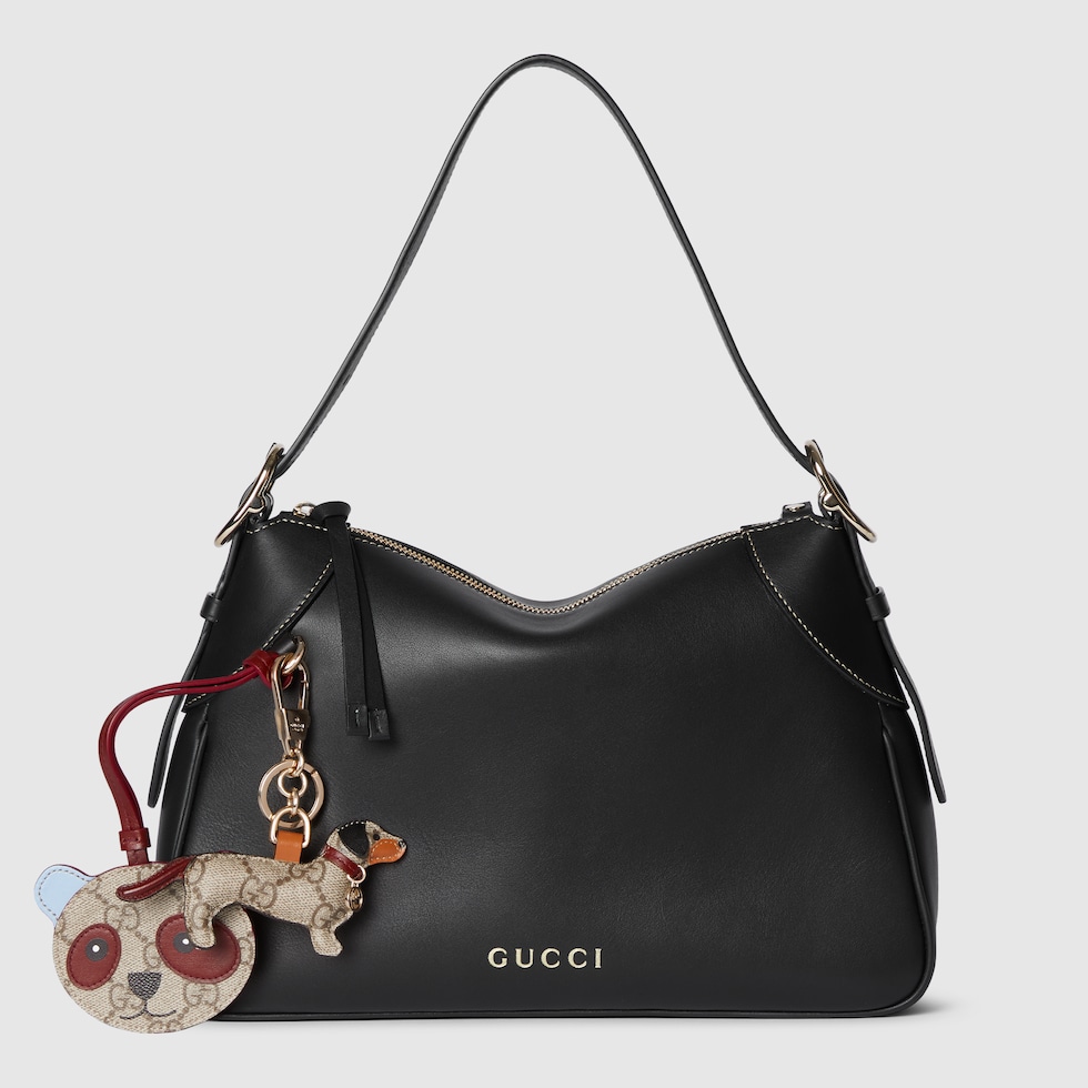 GG Emblem medium shoulder bag in black leather | GUCCI® RO