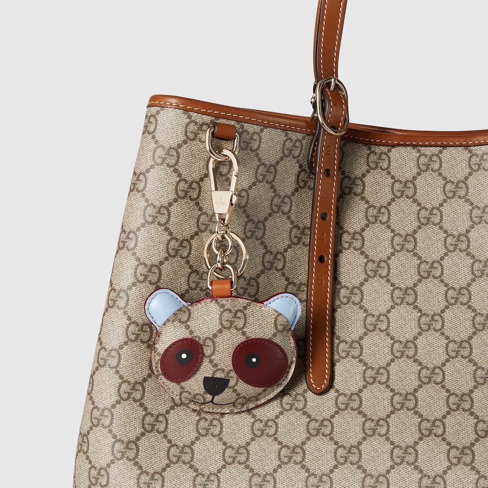 Panda-shaped bag charm in beige and dark brown canvas | GUCCI® US
