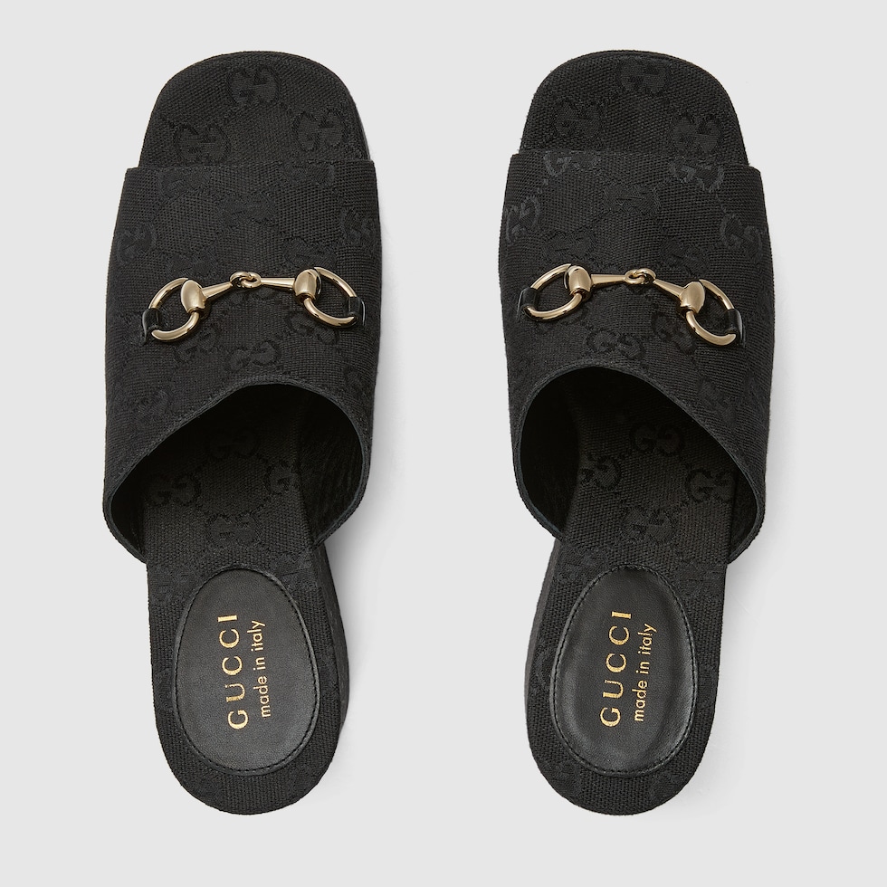 Women's wedge sandal with Horsebit in black GG canvas Women's wedge sandal with Horsebit in black GG canvas