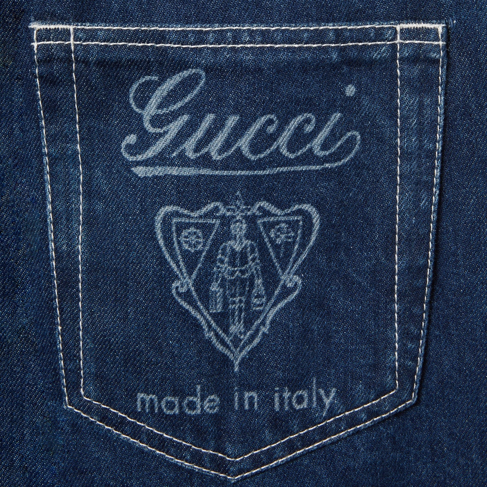 Slim cropped fit lasered denim pants in blue | GUCCI® US