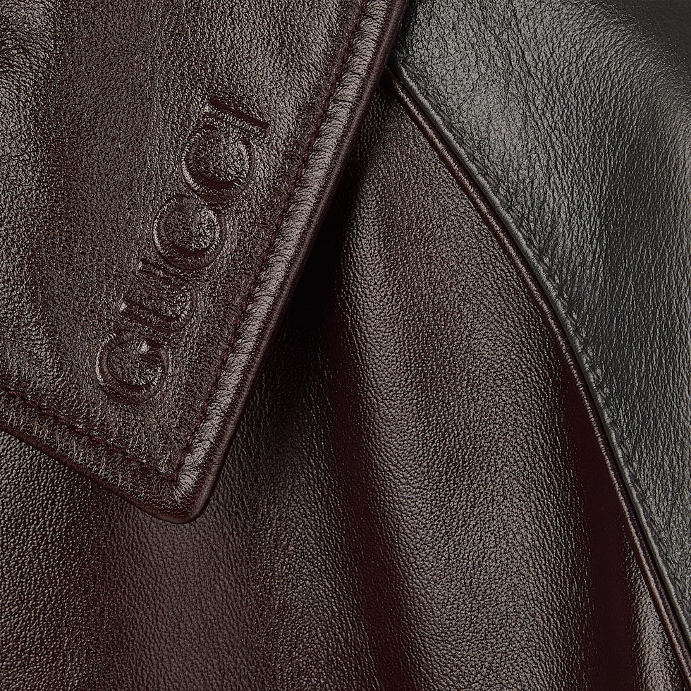 Embossed leather bomber jacket in bordeaux and dark grey