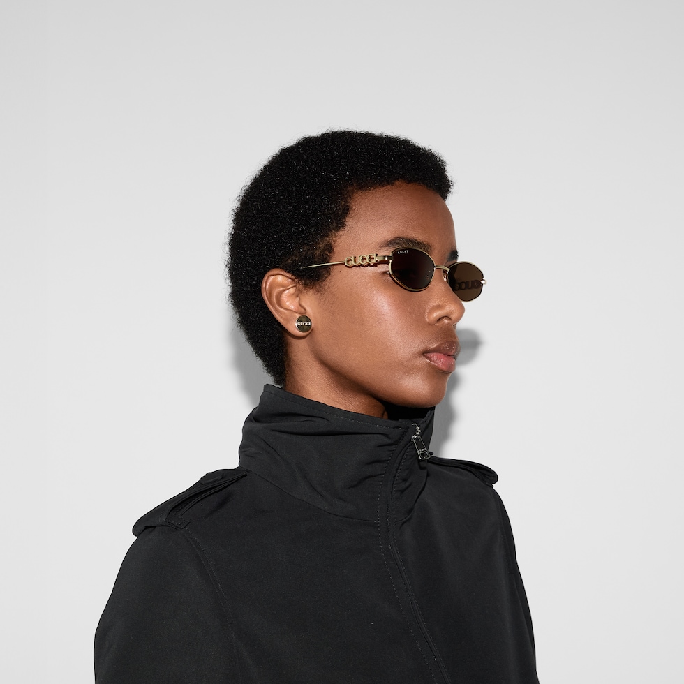 Oval frame sunglasses in gold-toned | GUCCI® US