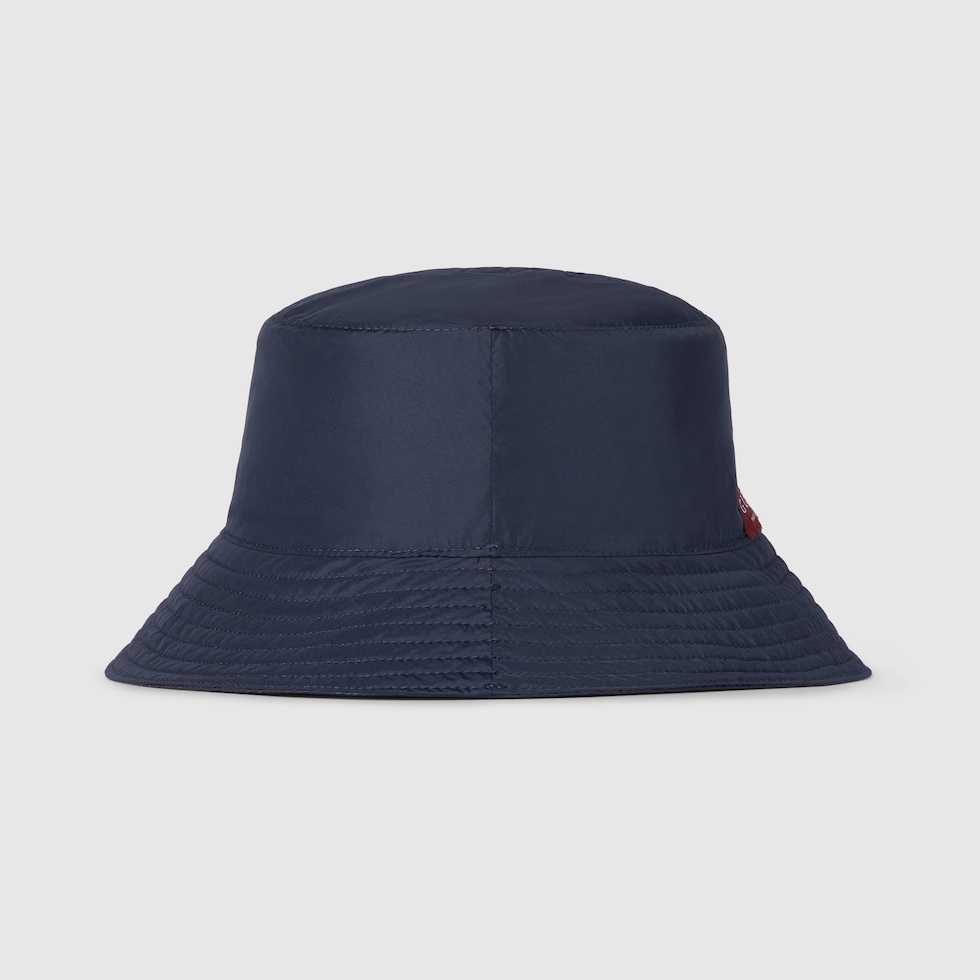 Reversible GG nylon bucket hat in dark blue | GUCCI® FI