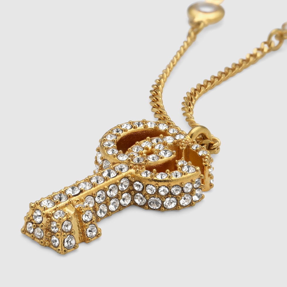 GG Marmont key crystal necklace in gold finish | GUCCI® US GG Marmont key crystal necklace in gold finish | GUCCI® US