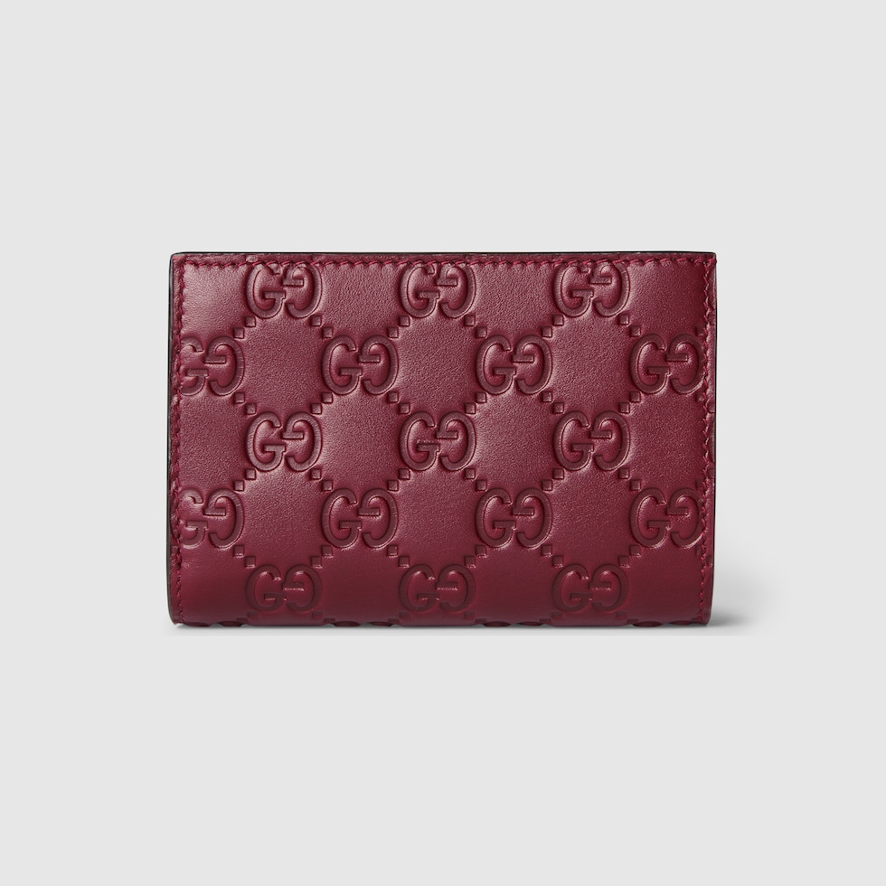 折りたたみ財布 MINI GG EMBLEM WALLET GG Emblem small wallet in blue and ivory denim | GUCCI® US