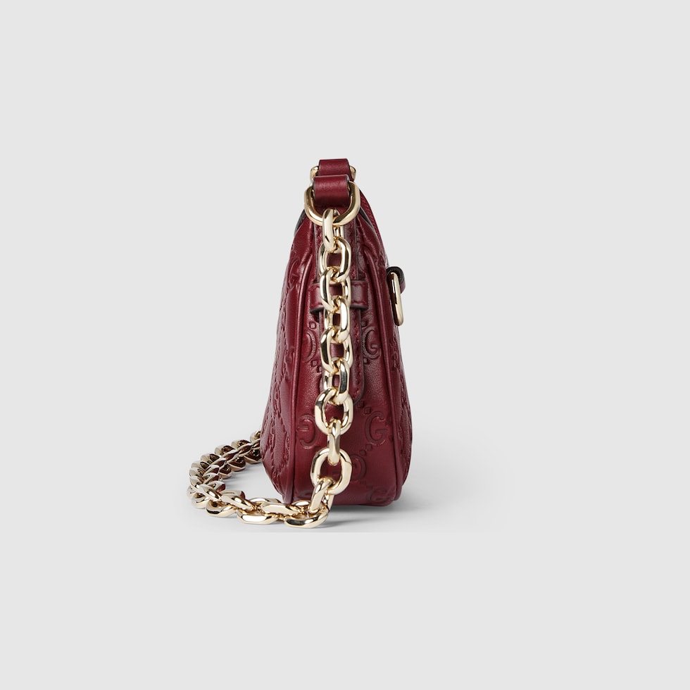 GG Emblem mini shoulder bag in Rosso Ancora red GG leather