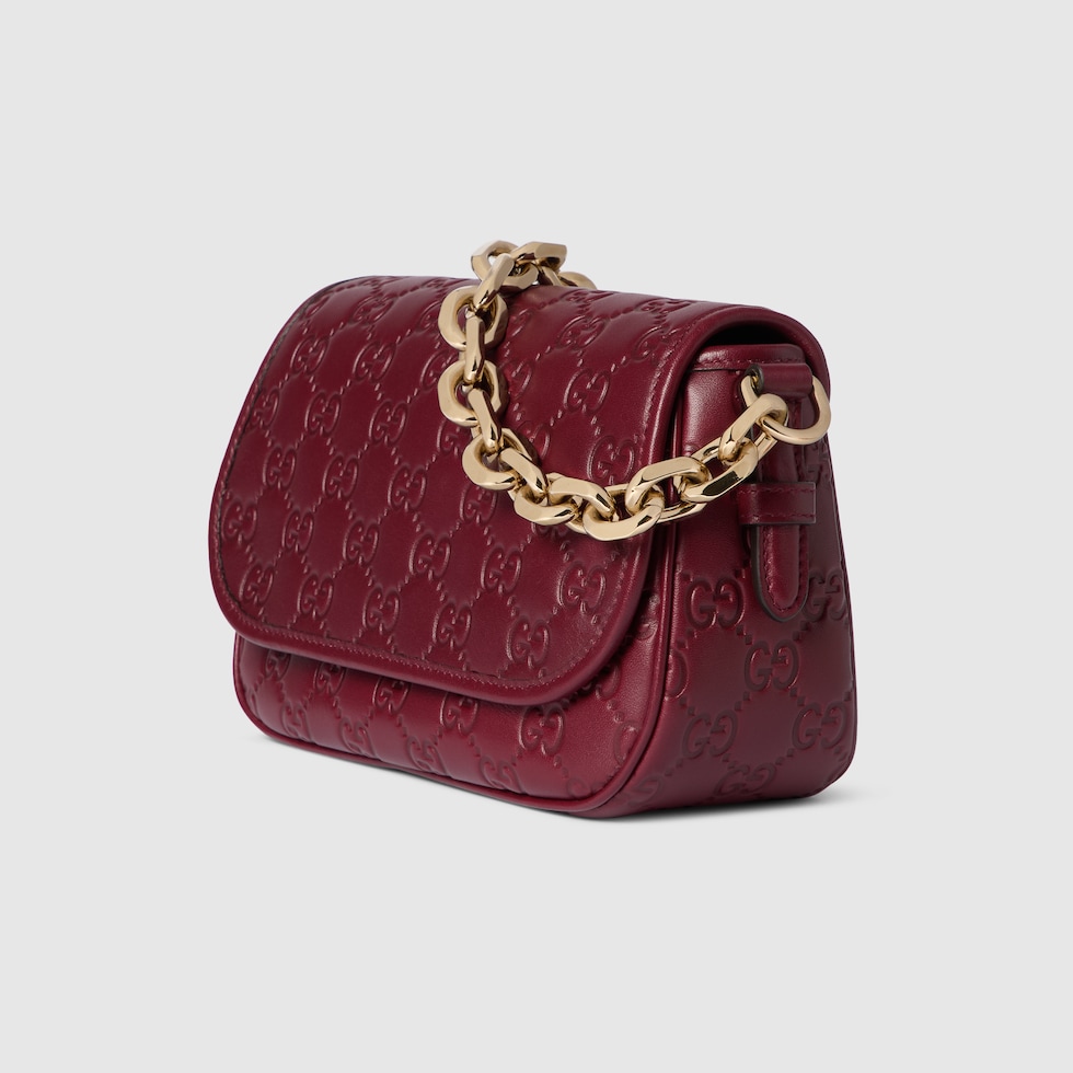 GG Emblem small shoulder bag in Rosso Ancora red GG leather