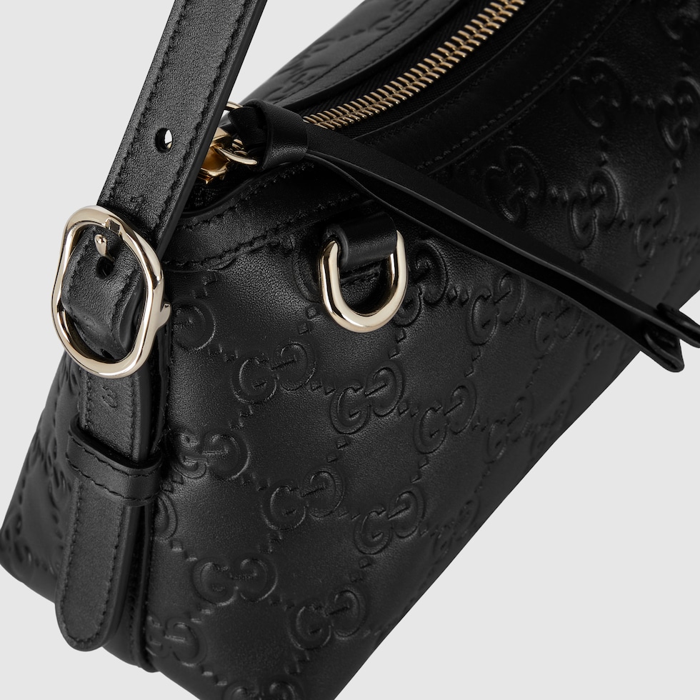 GG Emblem small shoulder bag in black GG leather | GUCCI® AU