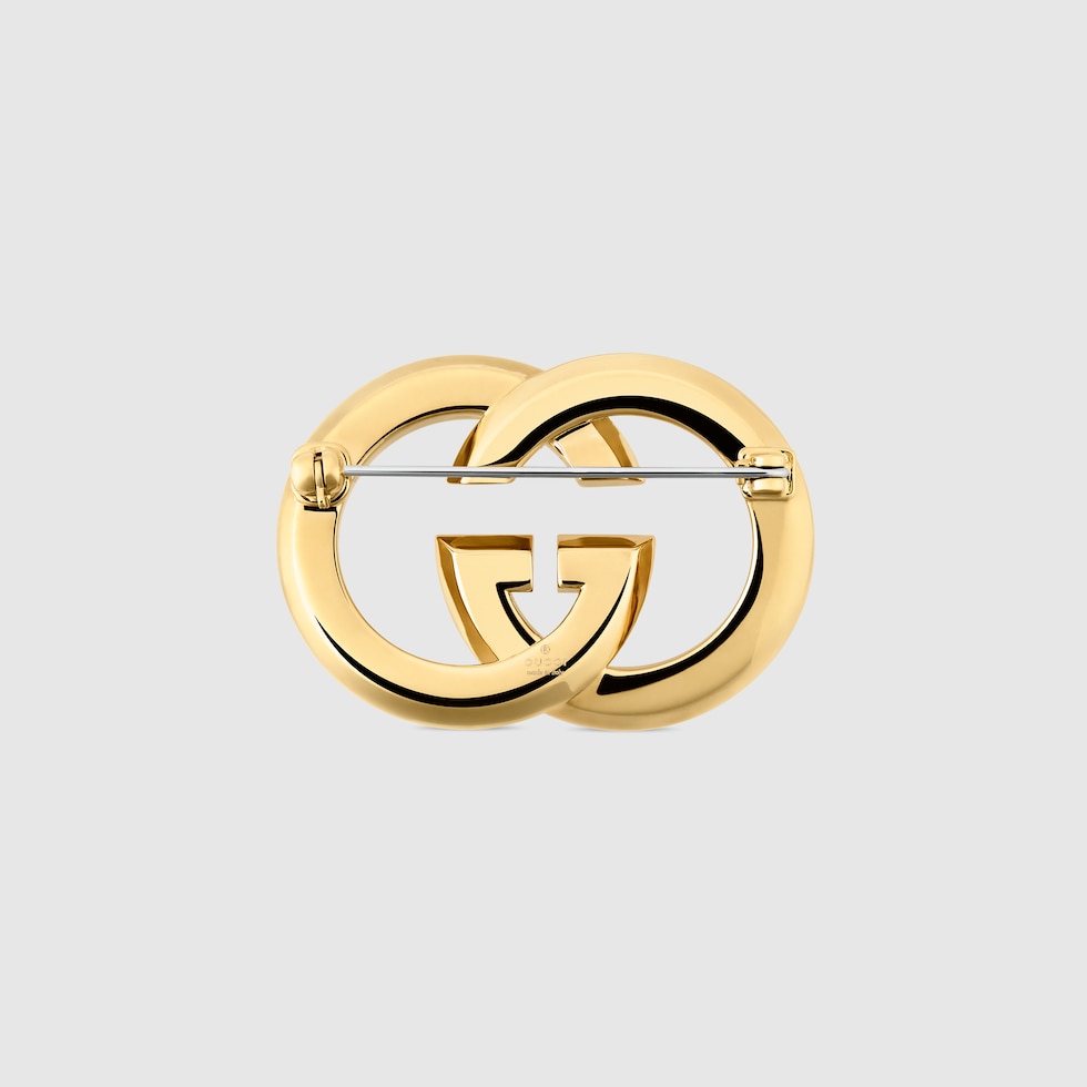Gucci Interlocking crystal brooch in gold-toned brass | GUCCI® US