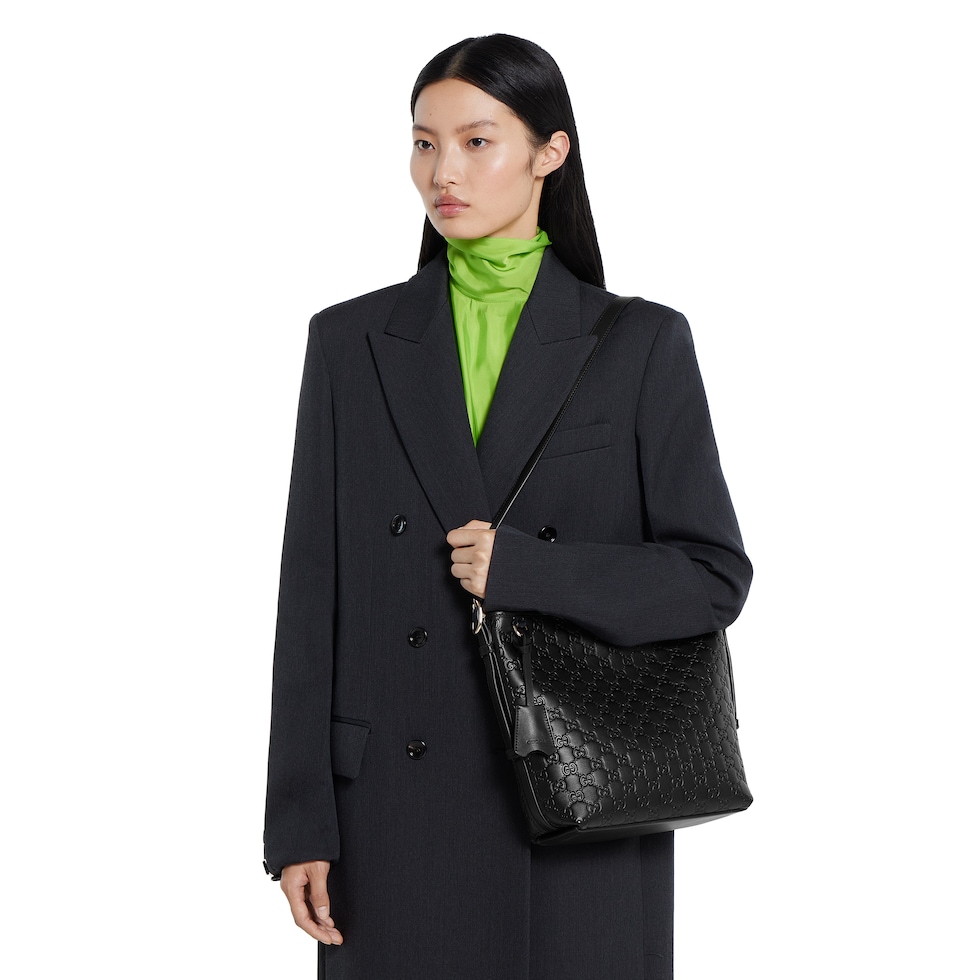 GG Emblem small shoulder bag in black GG leather | GUCCI® US