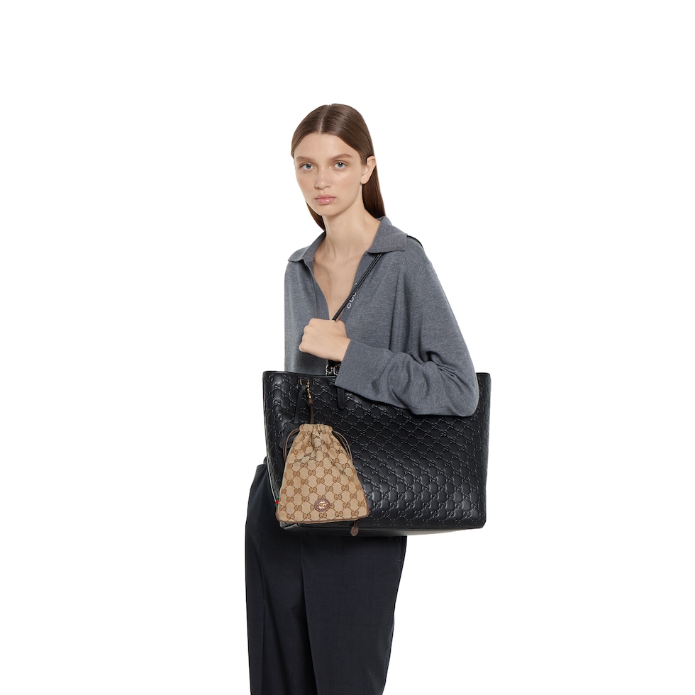 Gucci Minuet pouch charm in beige and brown GG canvas | GUCCI® US