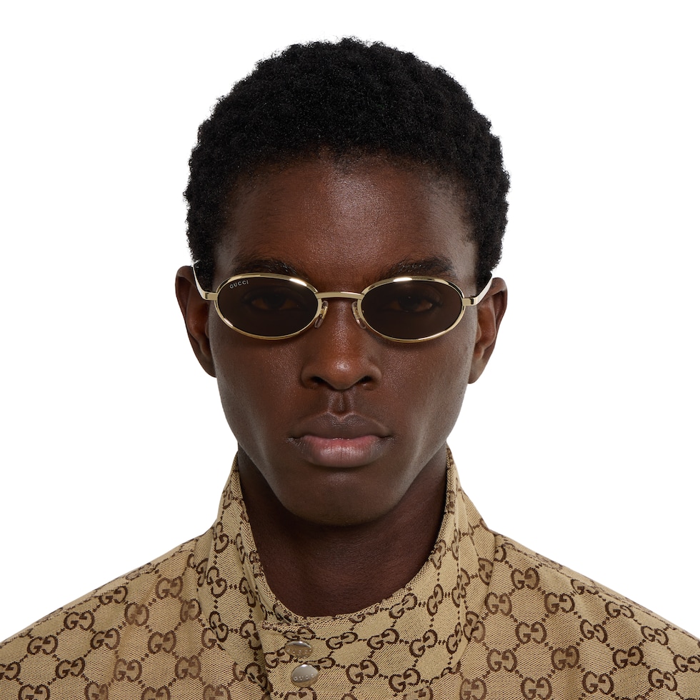 Oval frame sunglasses in gold-toned | GUCCI® US