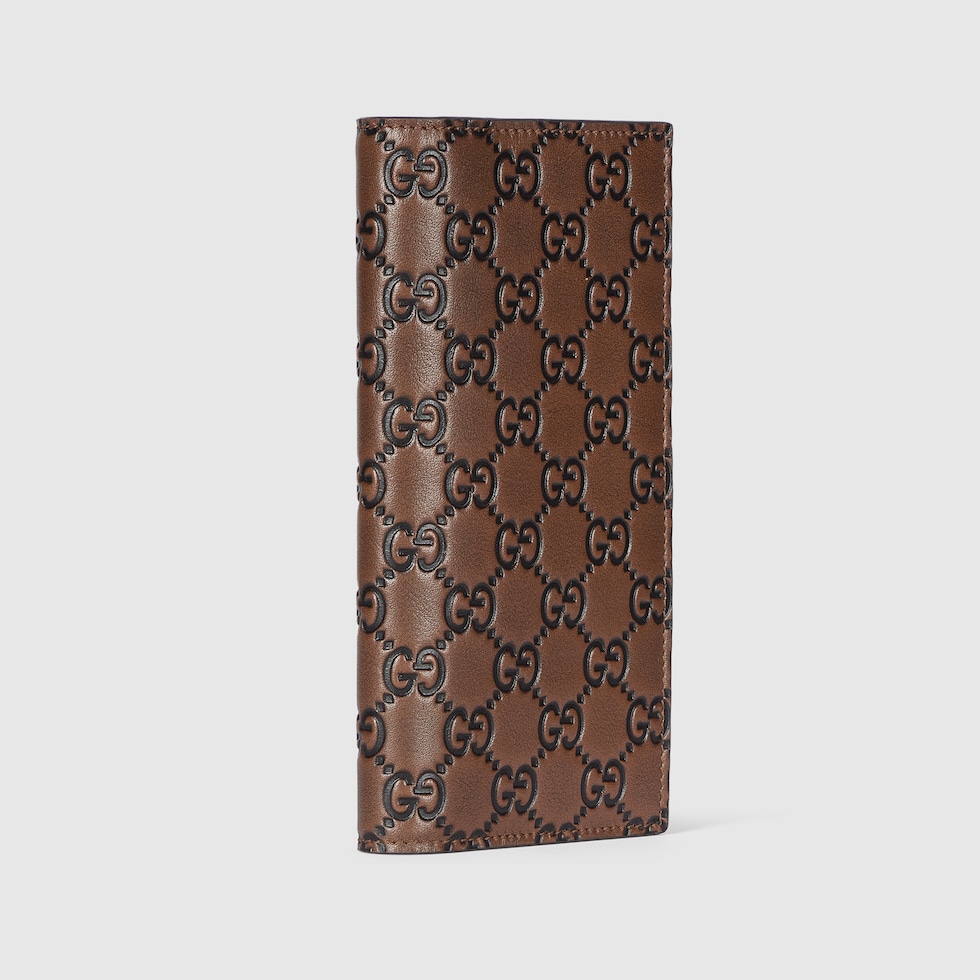 GG Emblem long wallet in brown and black GG leather | GUCCI® US