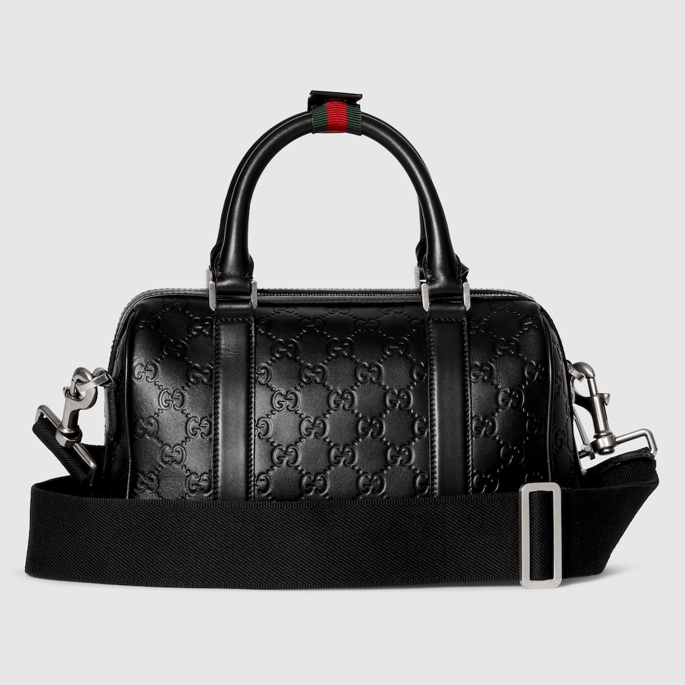 GG Emblem small duffle bag in black GG leather | GUCCI® US