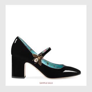 Patent leather mid-heel pump with bee